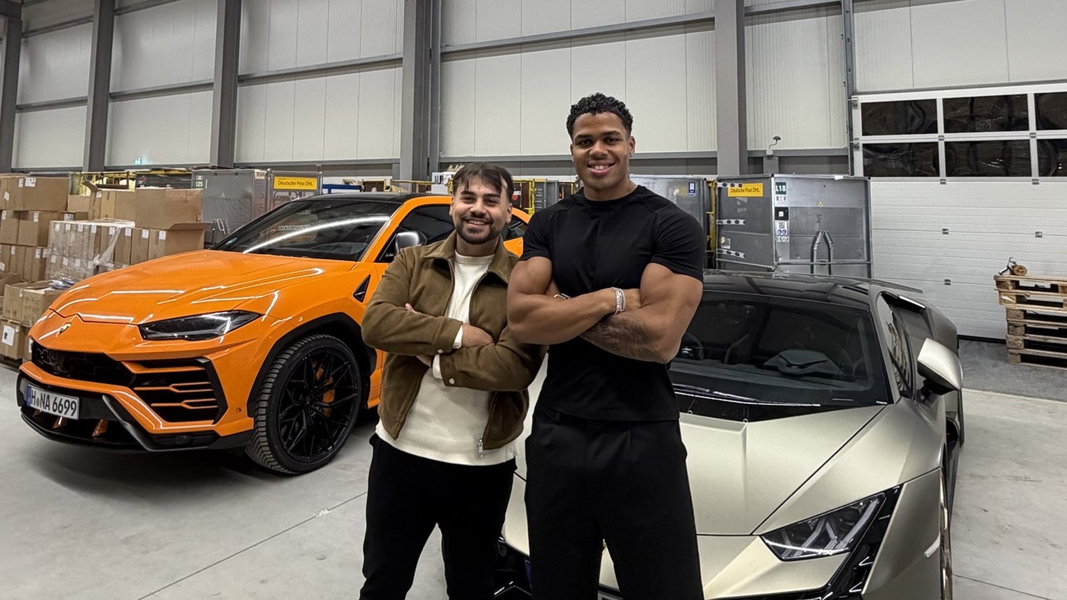 Nahim Sky of Sidejeans and Ezhan Atak of Adverfly in the Sidejeans warehouse after the first TikTok live, between an orange Lamborghini Urus and a Lamborghini Huracán